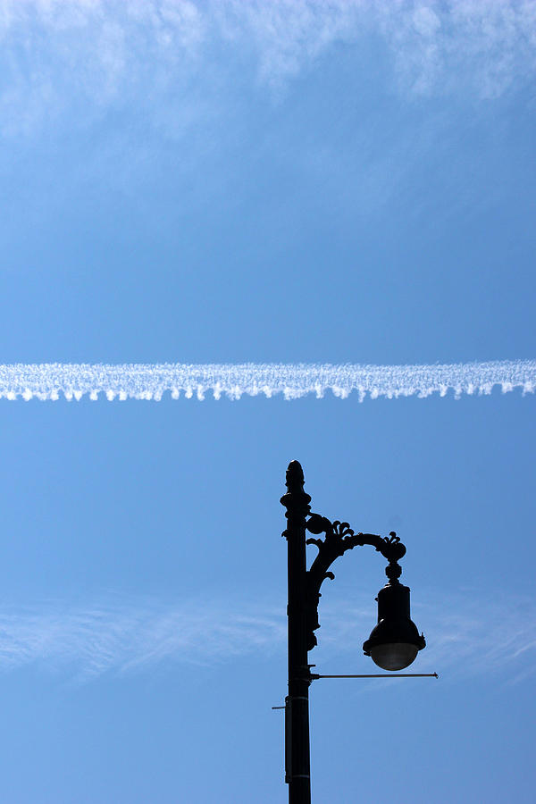 Streetlamp and Vapor Trail Photograph by Mary Bedy
