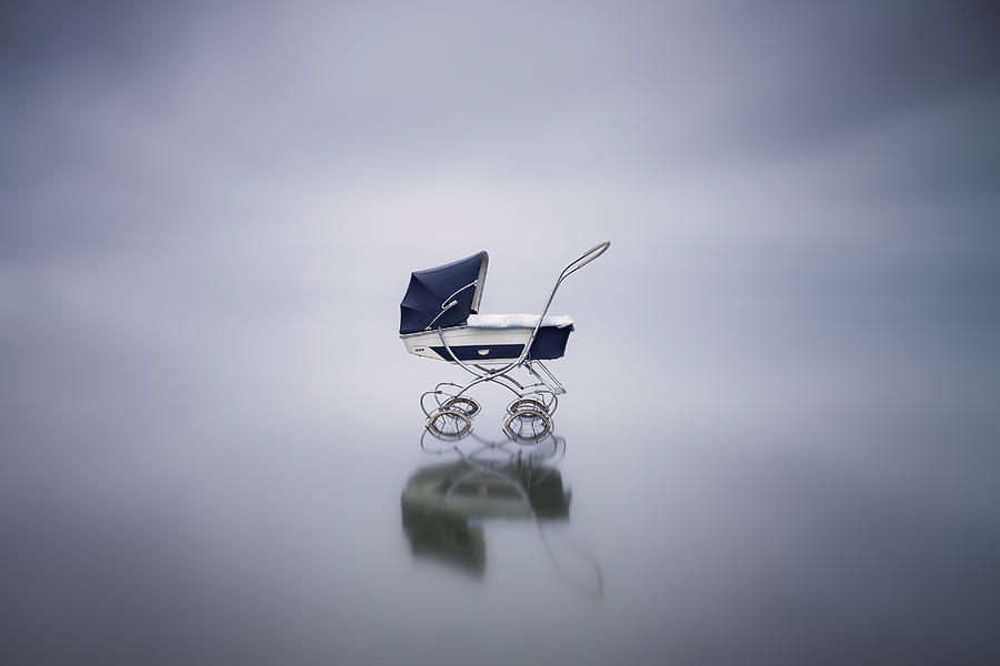 Stroller in a lake Photograph by Westend61