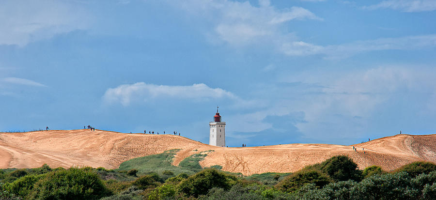 Lighthouse on sand dunes Photograph by Mike Santis