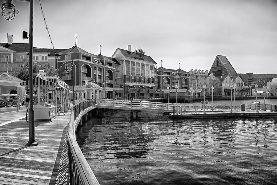 Black And White Photograph - Strolling on the boardwalk in Black and White Walt Disney World by Thomas Woolworth