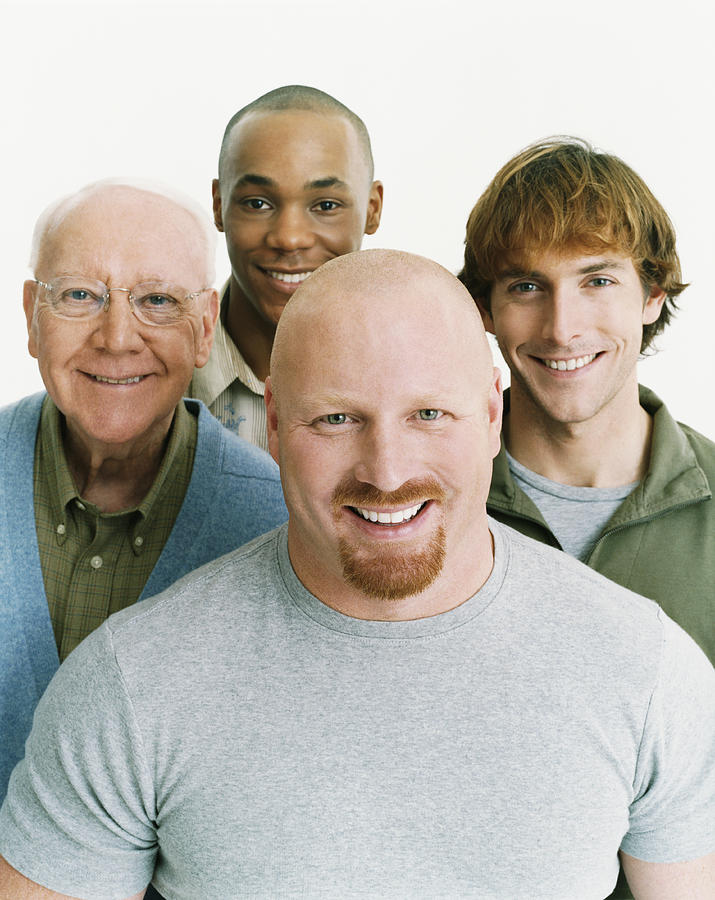 Studio Portrait of Four Smiling Men of Mixed Ages Photograph by Digital Vision.
