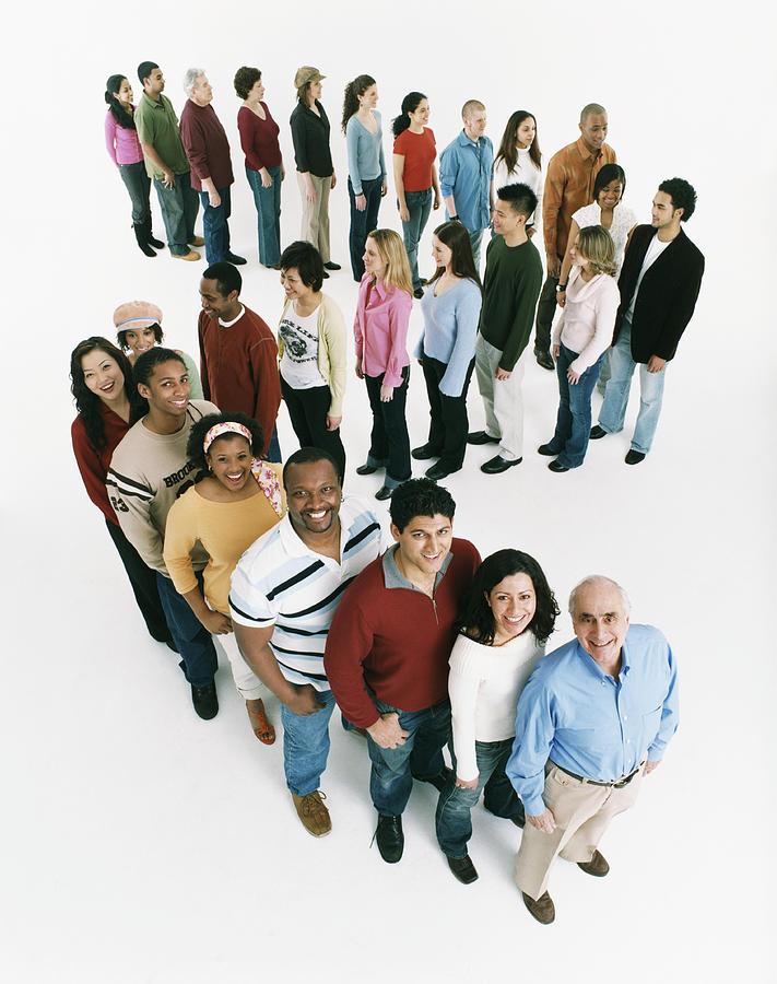 Studio Shot of a Large Mixed Age, Multiethnic Group of Men and Women Waiting in Line, Looking up at the Camera and Smiling Photograph by Digital Vision.