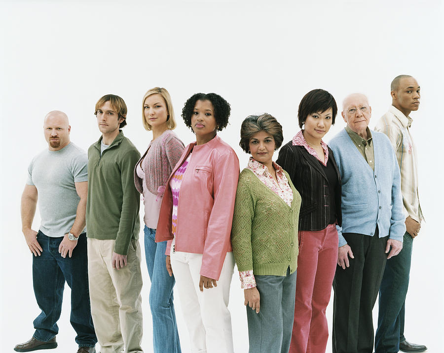 Studio Shot of a Mixed Age, Multiethnic Group of Assertive Men and Women Standing in a V Shape Photograph by Digital Vision.
