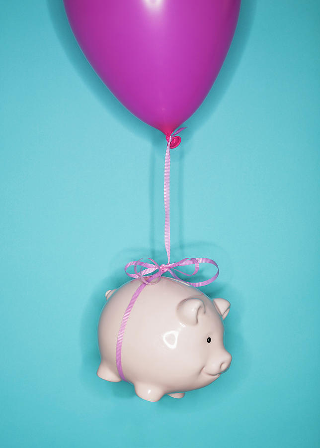 Studio Shot Of Piggy Bank Lifted By Photograph by Tetra Images Studio Shot Of Piggy Bank Lifted By Photograph by Tetra Images