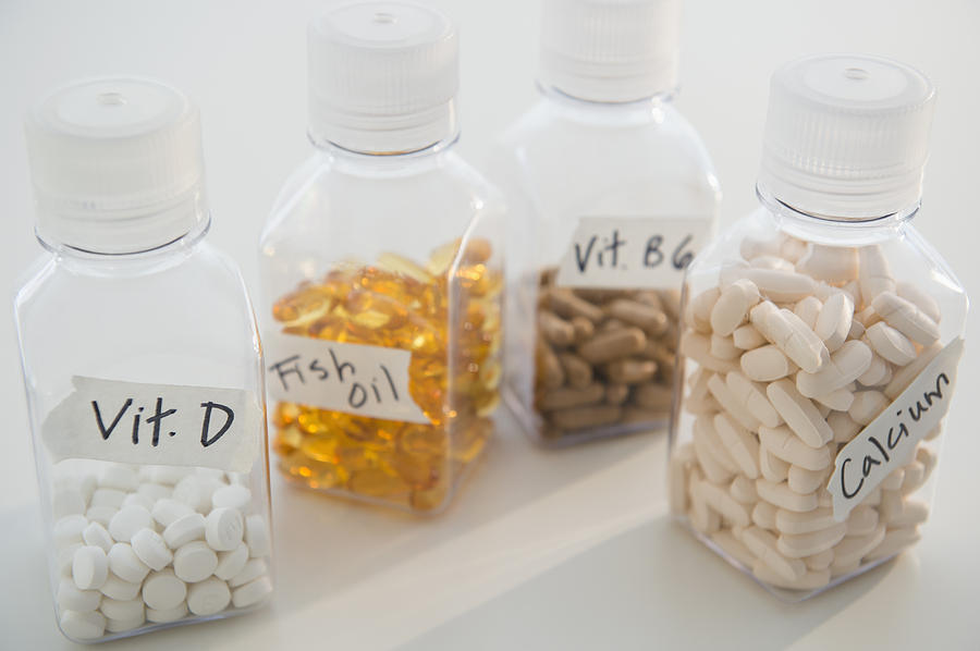 Studio shot of various pills in bottles Photograph by Jamie Grill
