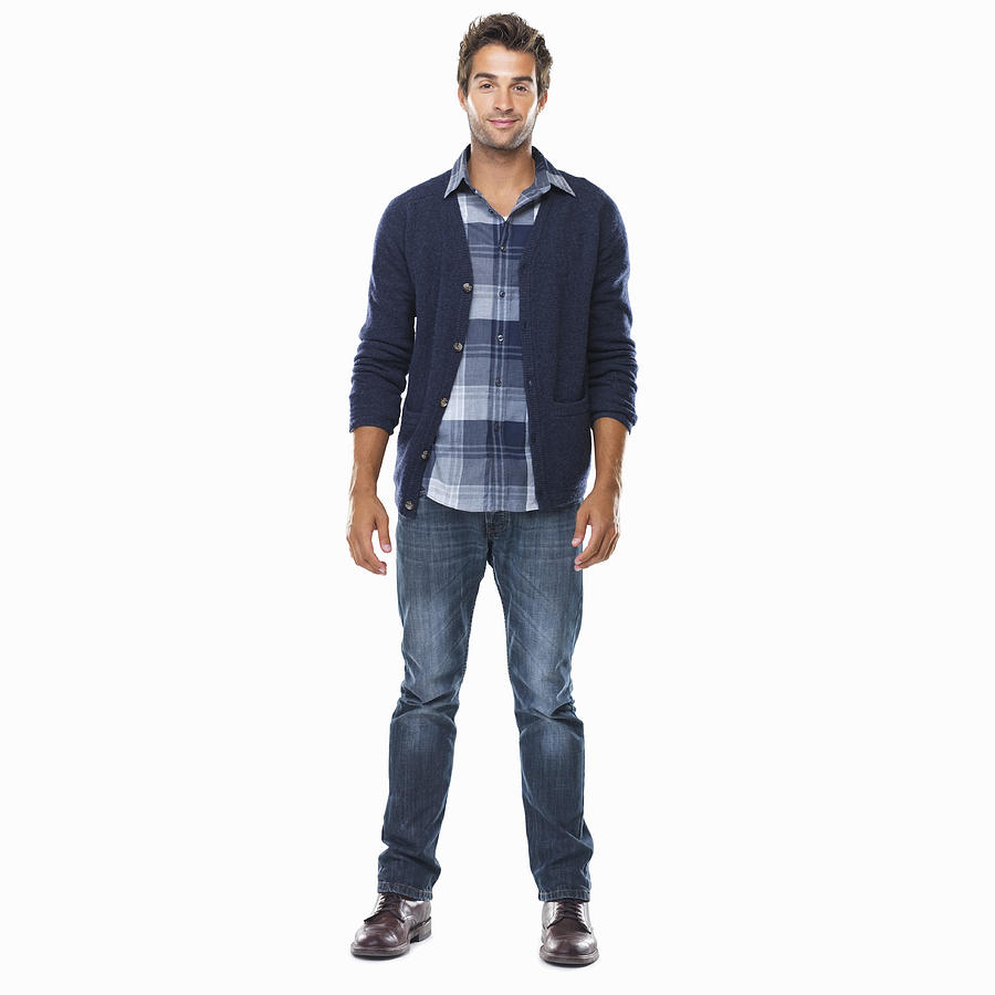 Studio shot of young confident man standing on white background and smiling Photograph by Momentimages Studio shot of young confident man standing on white background and smiling Photograph by Momentimages
