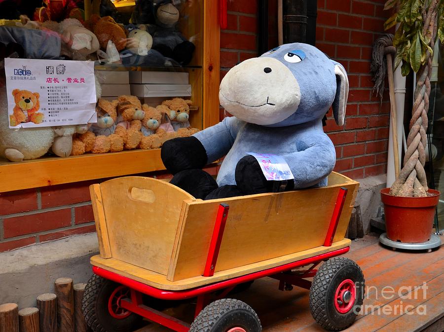 Stuffed donkey toy in wooden barrow cart Photograph by Imran Ahmed