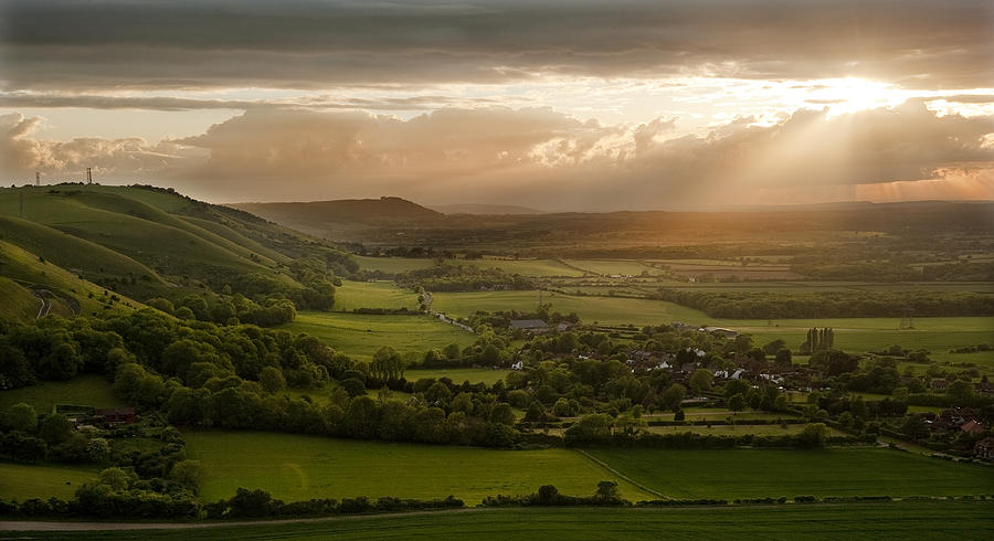 Stunning countryside landscape with sun lighting side of hills a Photograph  by Matthew Gibson