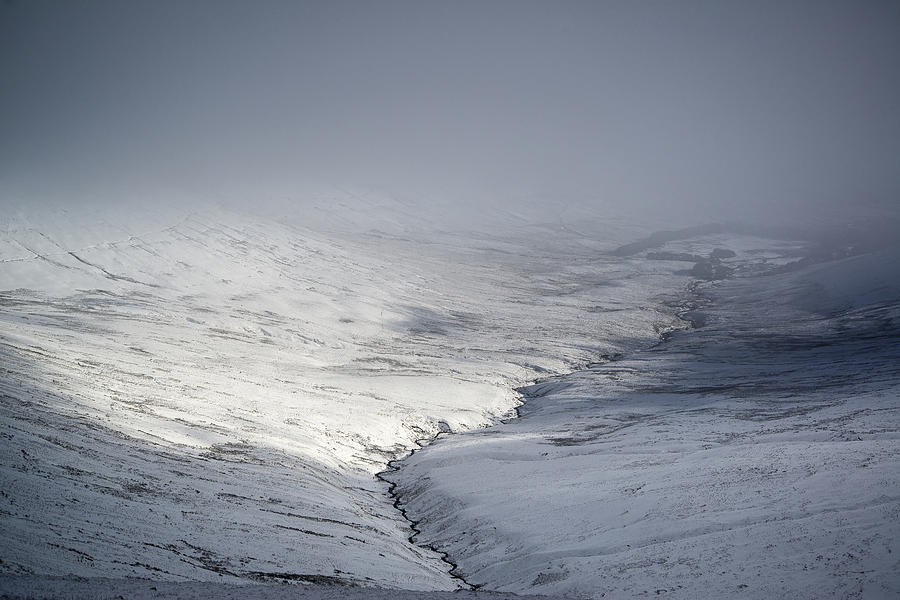 Winter Photograph - Stunning moody dramatic mountain Winter landscape looking into c by Matthew Gibson