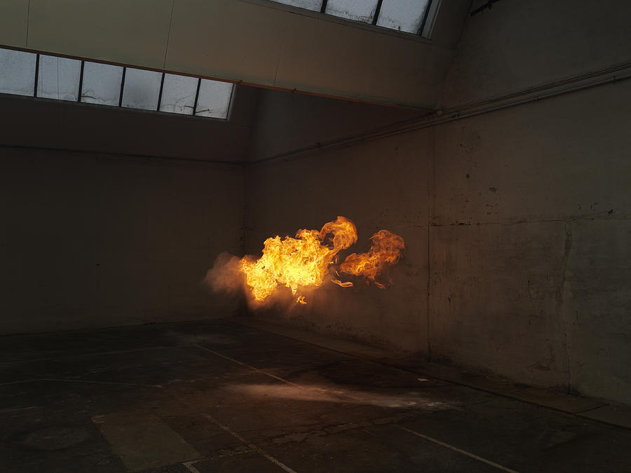 Subtle flame inside old warehouse Photograph by Henrik Sorensen