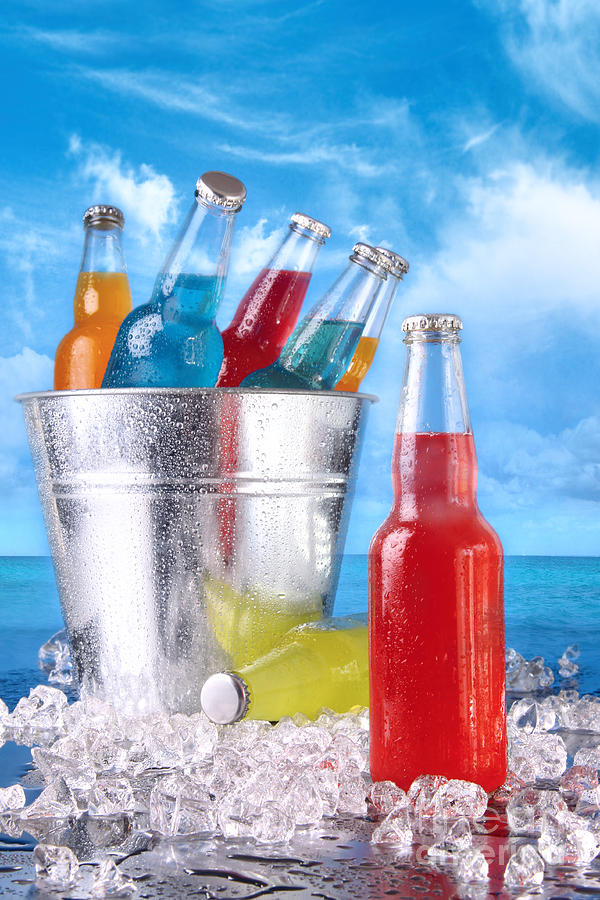 Summer drinks in ice bucket on the beach Photograph by Sandra Cunningham