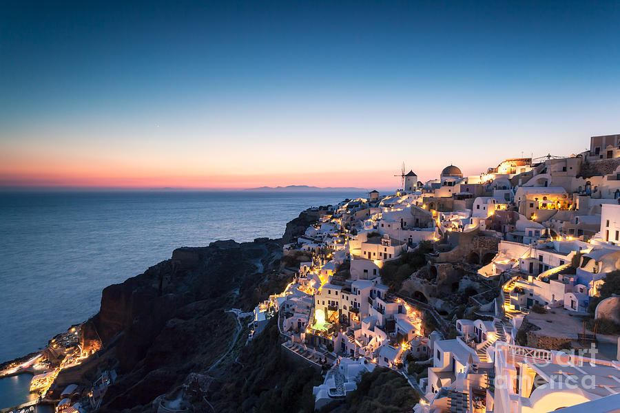 Summer sunset over Oia Photograph by Matteo Colombo