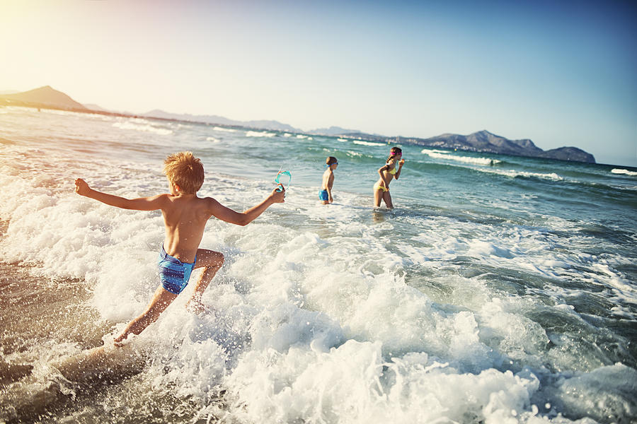 Summer vacations - kids playing at sea Photograph by Imgorthand