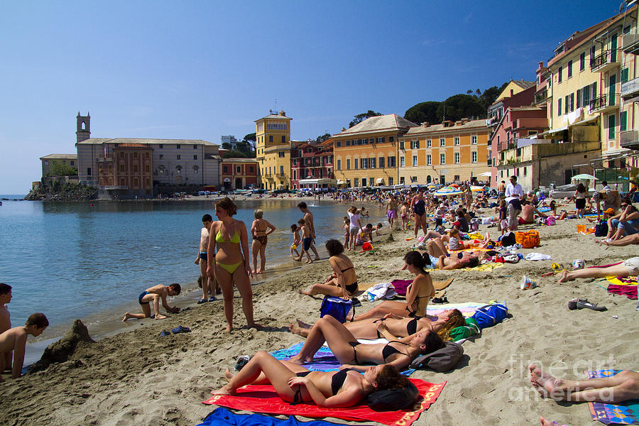 Beach Photograph - Sun bathers in Sestri Levante in the Italian Riviera in Liguria Italy by David Smith