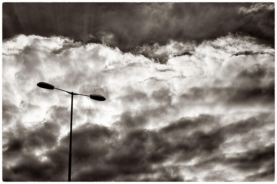 Sun Flair through the Clouds on a Driving Trip Photograph by Lenny Carter