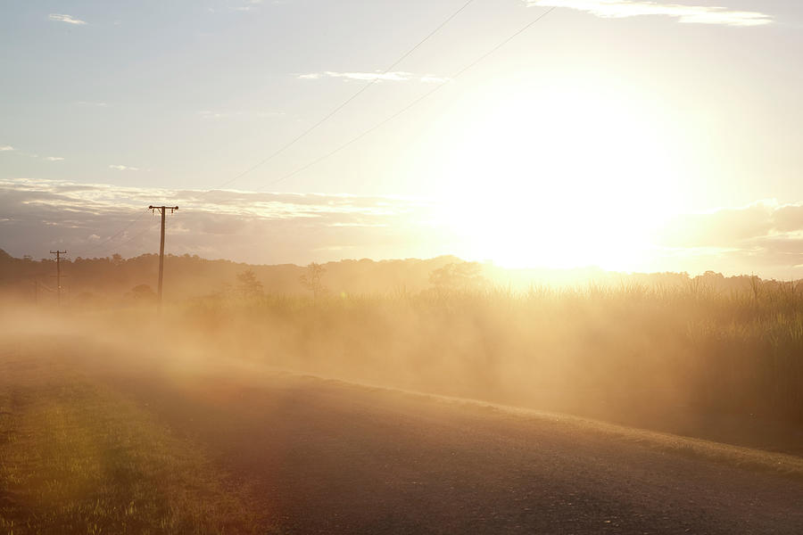 Sun Flare On  Australian Country Road Photograph by The Photo Commune