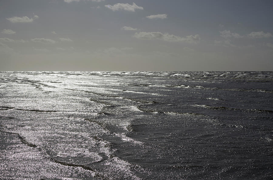 Sun Glistening On Sea Surface Near Beach Photograph by Guy Vanderelst