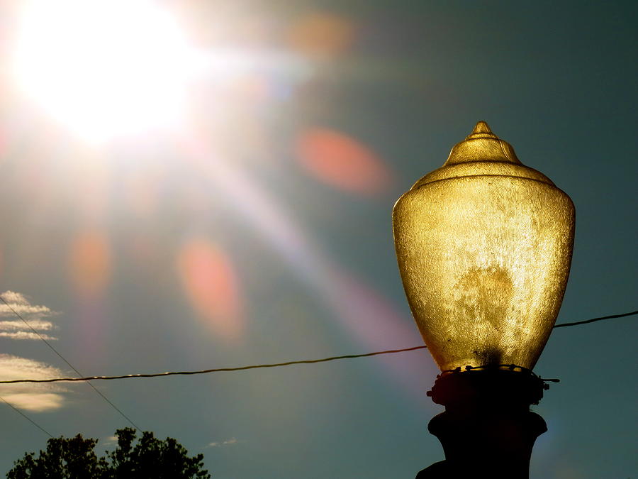 Sun Powered  Street Light Photograph by Chris Bavelles