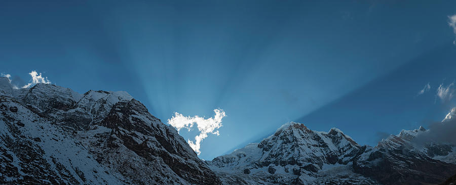 Sun Light Rays Beaming Over Blue Photograph by Fotovoyager