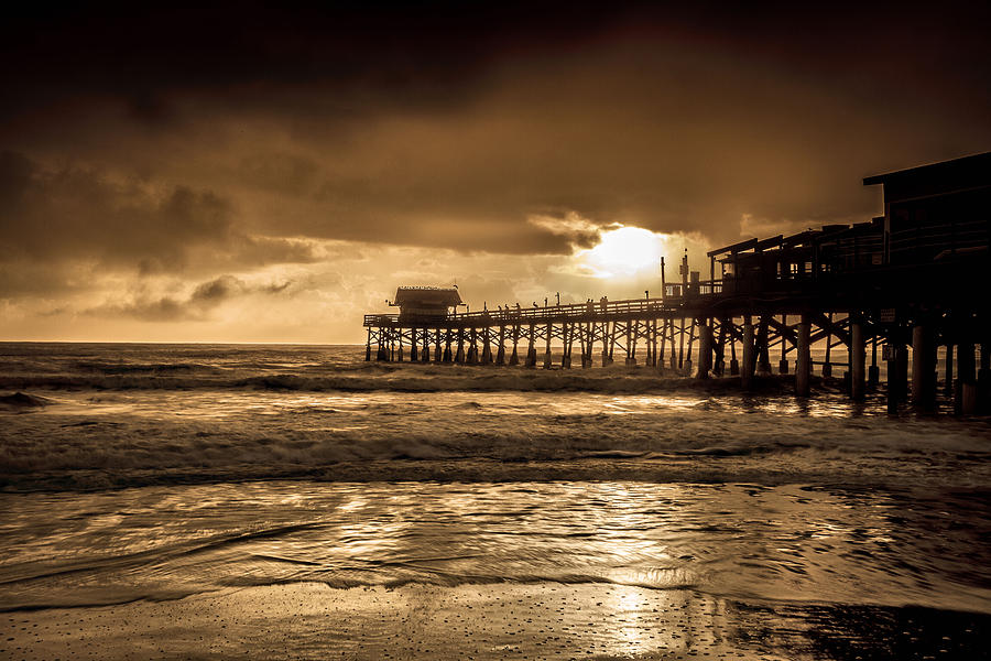 Sun over the Pier Photograph by Steven Reed