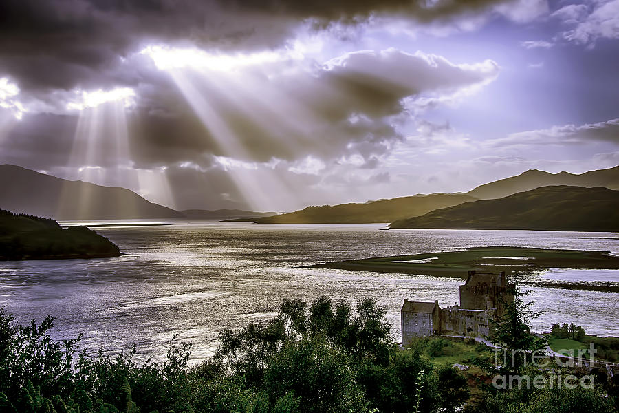 Sun Rays over Eilean Donan Castle Photograph by Chris Thaxter