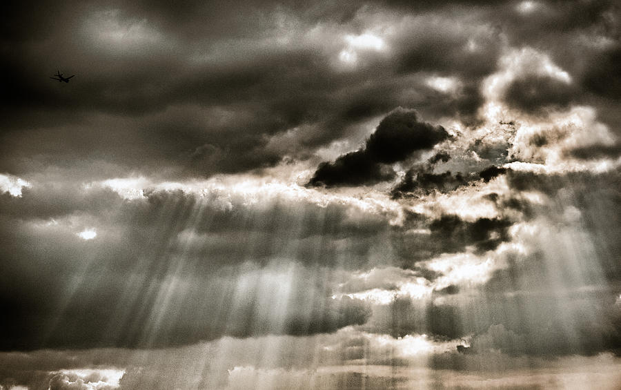 sun rays through clouds black and white