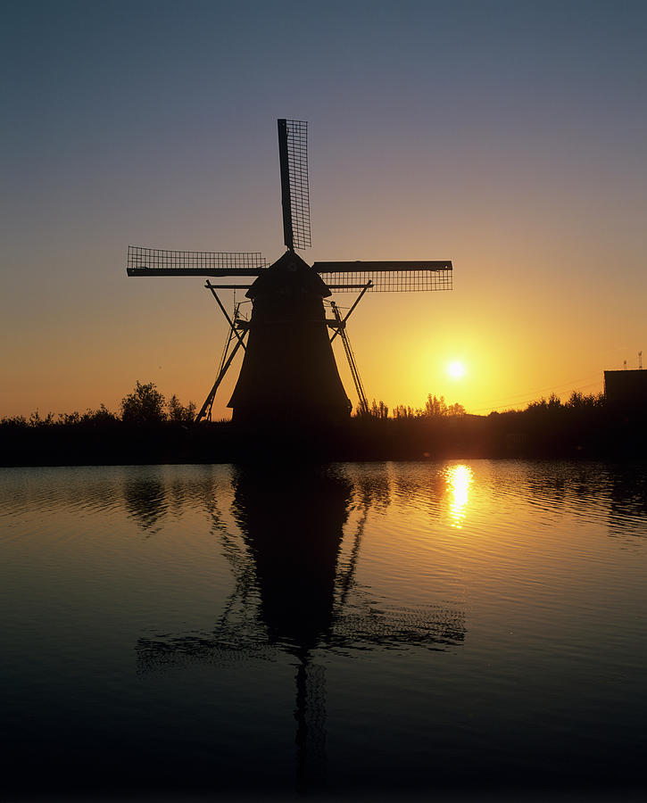 Sun Rising Behind A Windmill Photograph by Martin Bond/science Photo Library