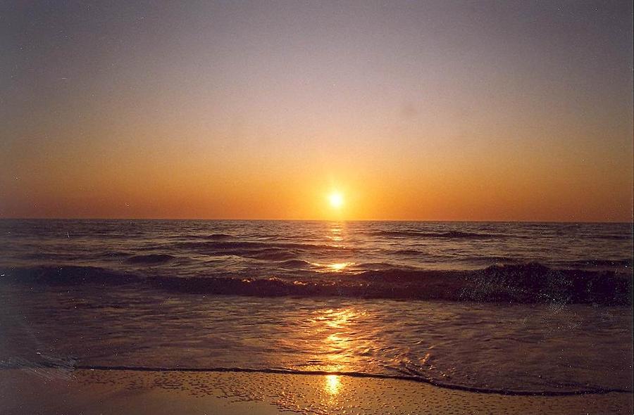 Sun setting at Ocean Beach Photograph by Cynthia Marcopulos