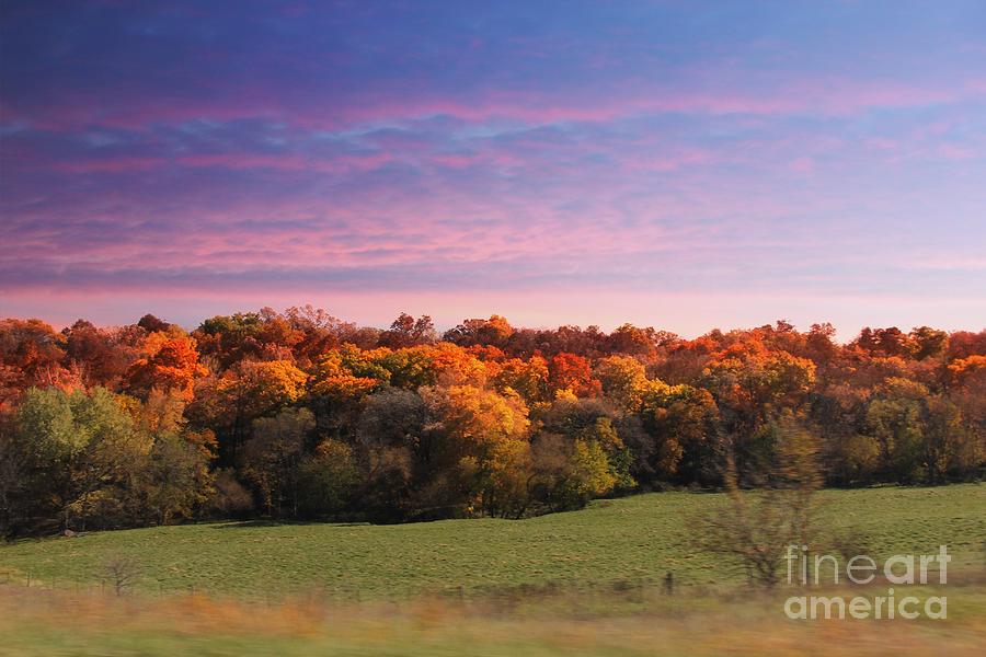 Sun setting over Fall colors Photograph by Yumi Johnson