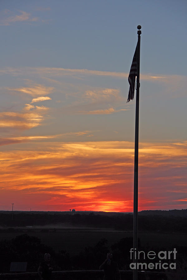 Sun setting over the Flag Photograph by Yumi Johnson