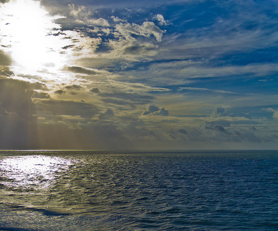 Sun through the clouds Photograph by Jonny D