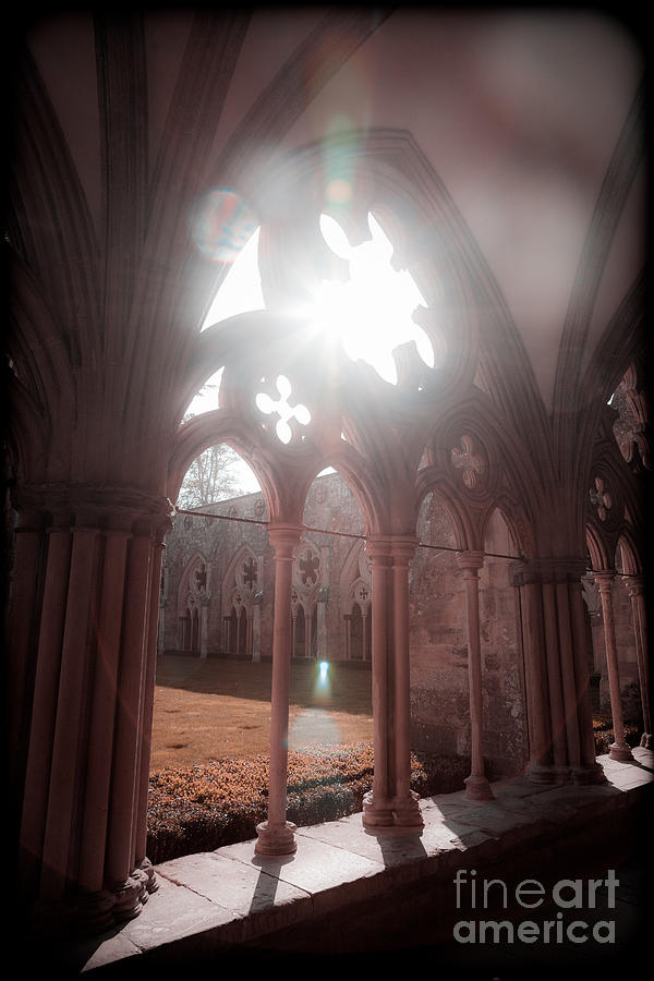 Sunburst through Gothic arch Photograph by Peter Noyce