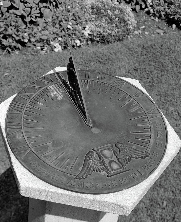 Sundial On Cement Pedestal In Garden Photograph by Vintage Images