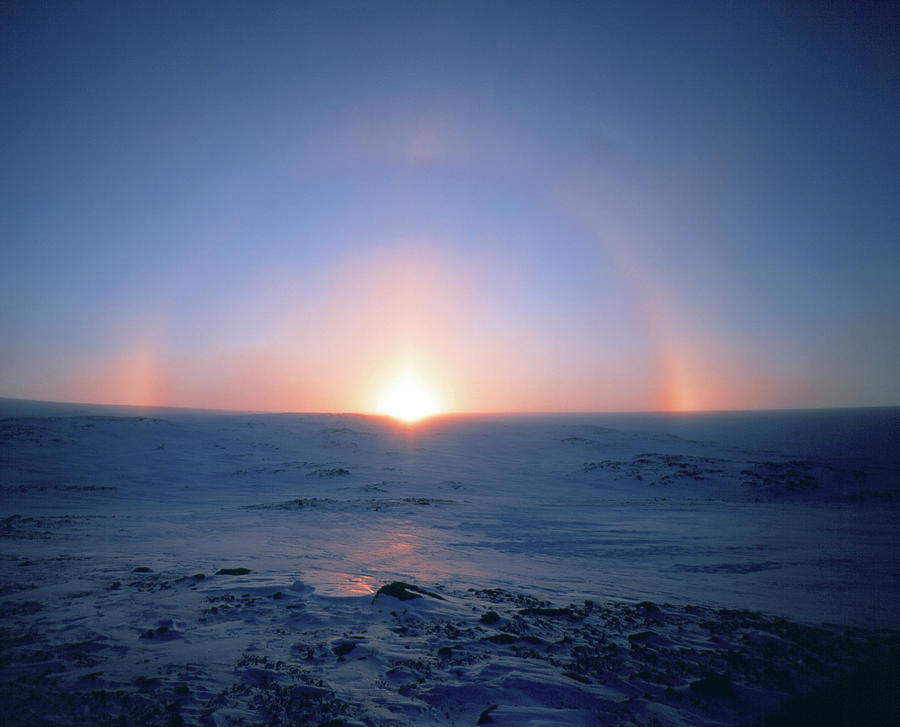 Sundogs And Halo Around The Setting Sun Photograph by Simon Fraser/science Photo Library