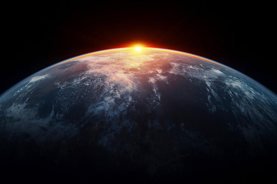 Sunlight eclipsing planet earth Photograph by Bjorn Holland