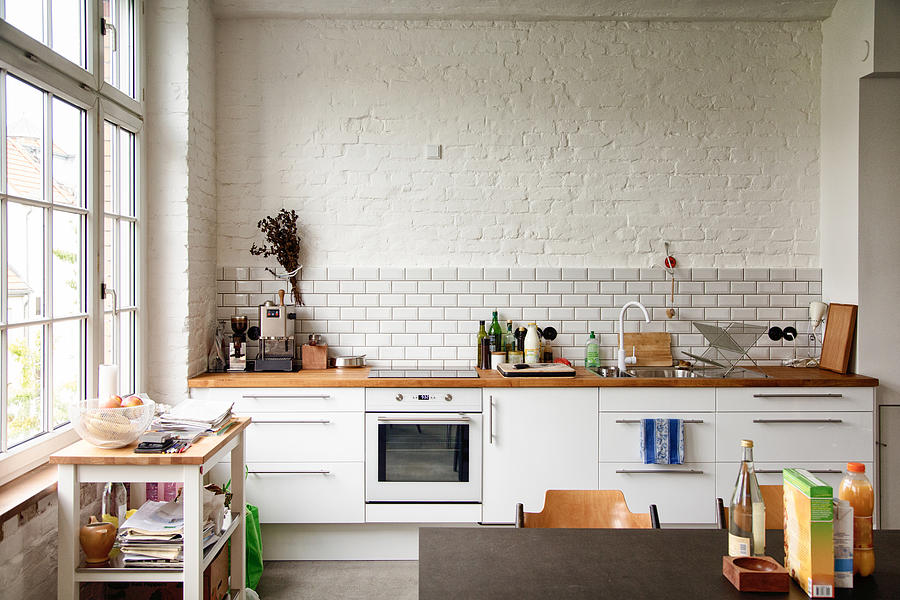 Sunny white European kitchen Photograph by NicolasMcComber