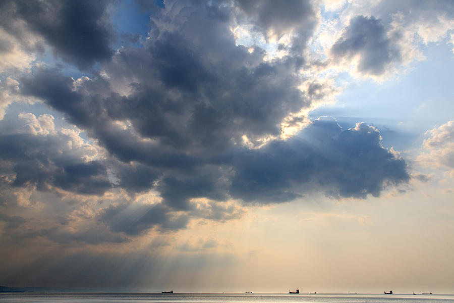 Sunrays scattered by clouds over Trieste Bay Photograph by Ian Middleton
