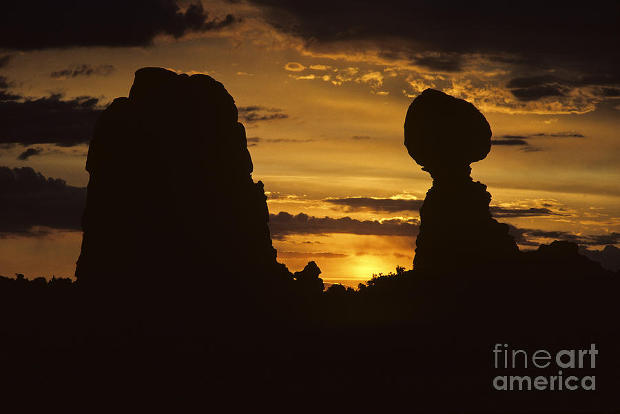 Nature Photograph - Sunrise Arches National Park with Balanced Rock silhouetted agai by Jim Corwin
