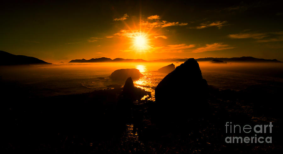 Sunrise at Papuma Beach Photograph by Arik S Mintorogo