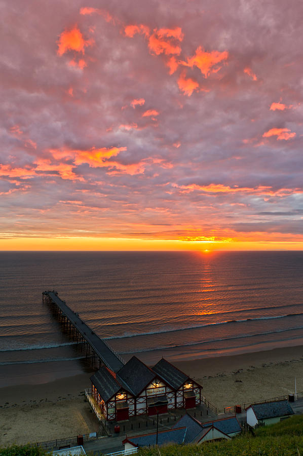 Sunrise at Saltburn pier and seafront portrait Photograph by Gary Eason