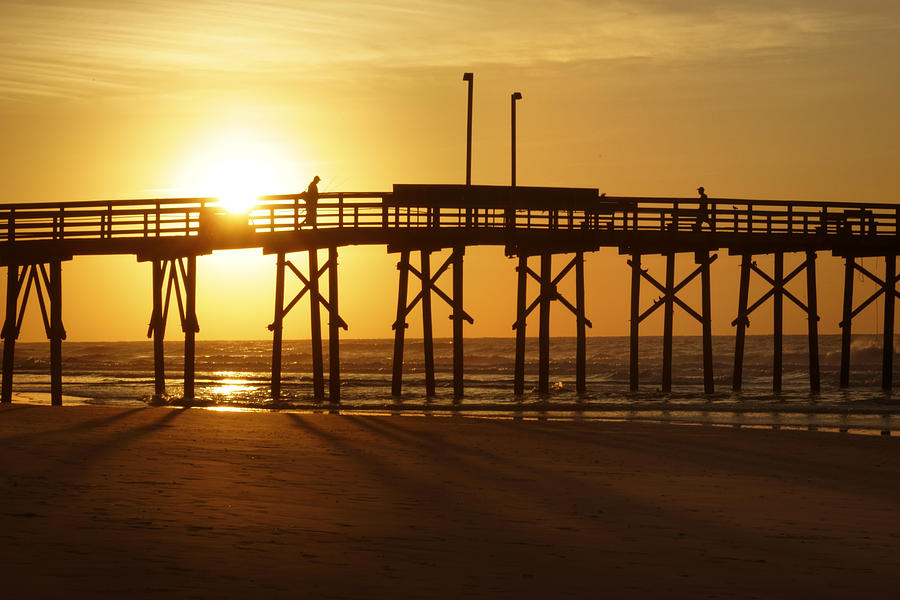 Sunrise at the Jolly Roger Pier 2 Photograph by Mike McGlothlen