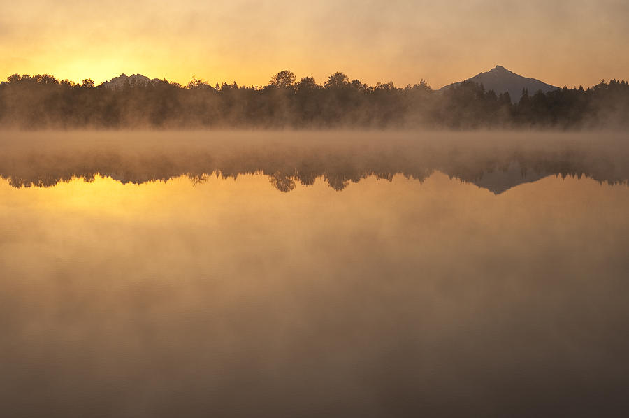Inspirational Photograph - Sunrise in fog Lake Cassidy with Mount Pilchuck and reflections  by Jim Corwin