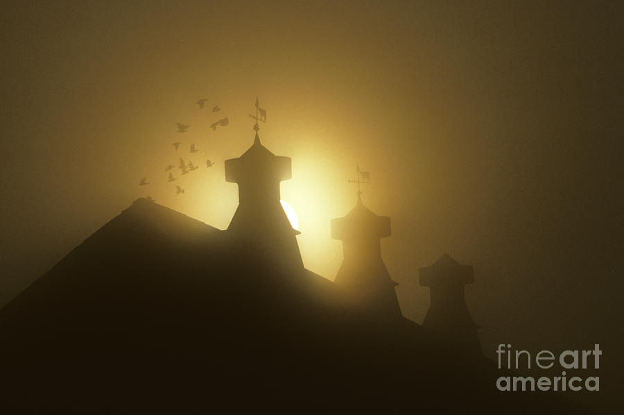 Sunrise in fog with old barn and steeples with weather vanes Photograph by Jim Corwin