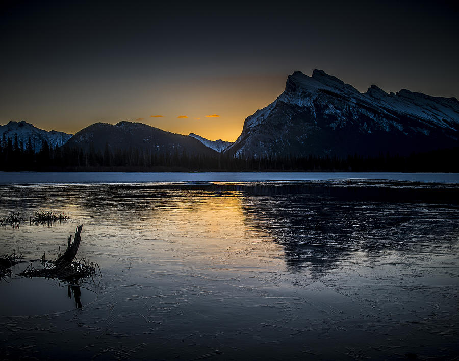 Sunrise on an Frozen Lake Photograph by Bill Cubitt