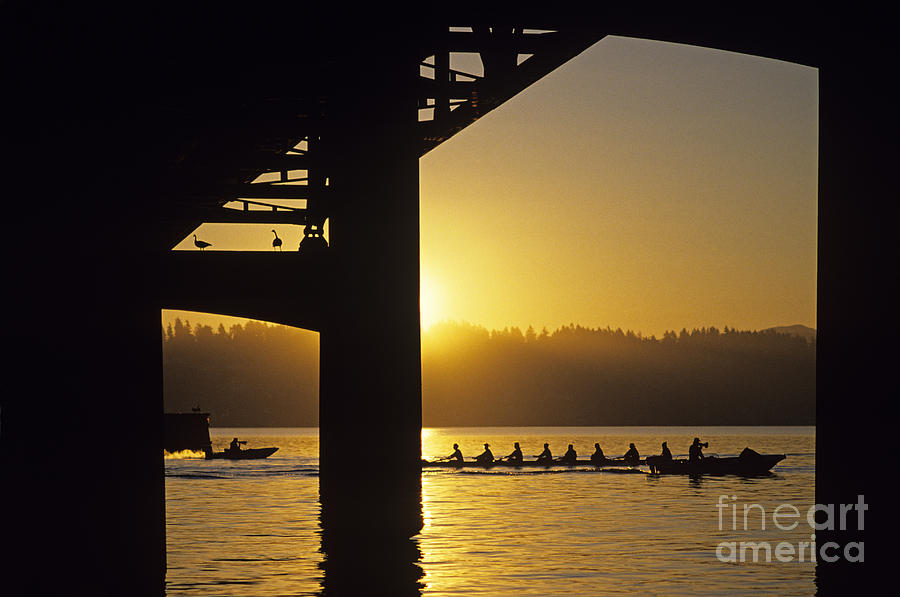 Sunrise on Lake Washington below bridge with eight woman crew Photograph by Jim Corwin