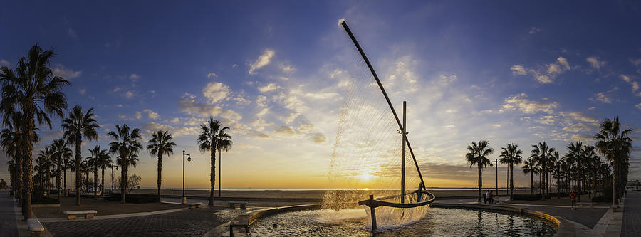 Sunrise on Mediterranean Ocean beach promenade palm trees Valencia Spain Photograph by fotoVoyager
