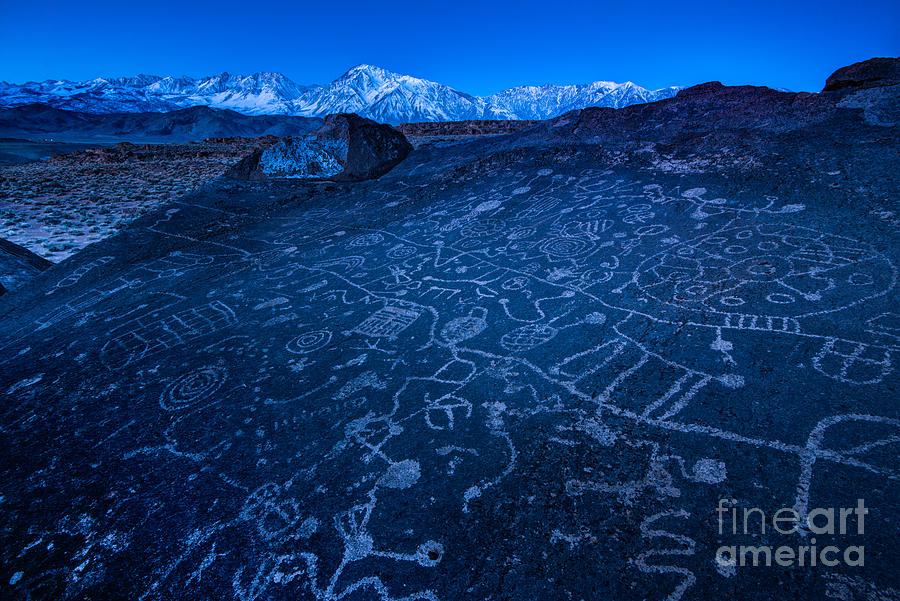 Sunrise on Sky Rock Petroglyph and Sierra Nevada Mountains Photograph by Gary Whitton