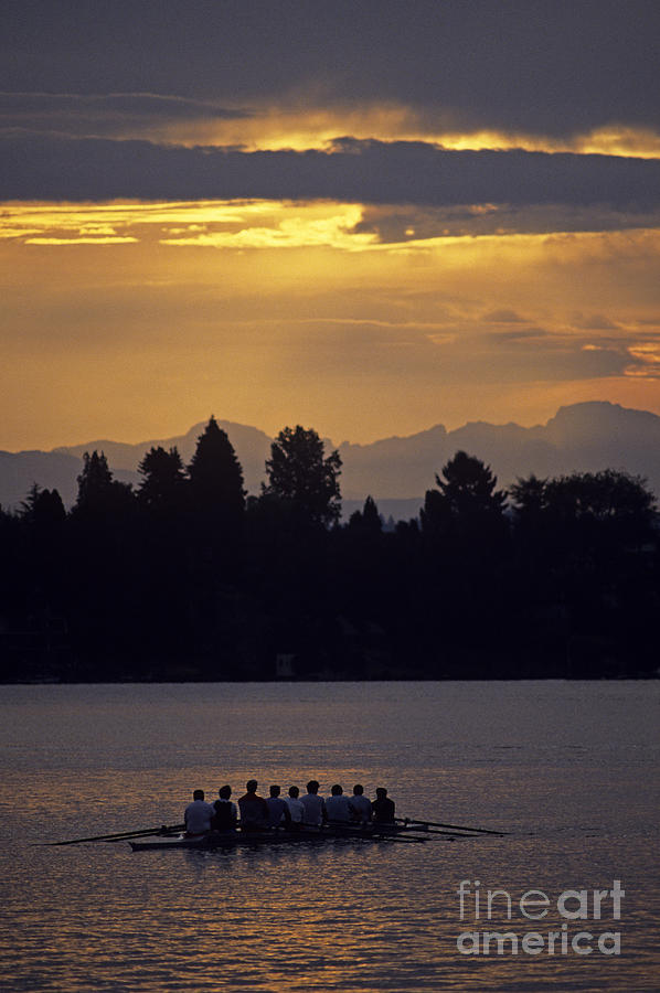 Sunrise on the Montlake Cut with eight man crew rowing stormy we Photograph by Jim Corwin
