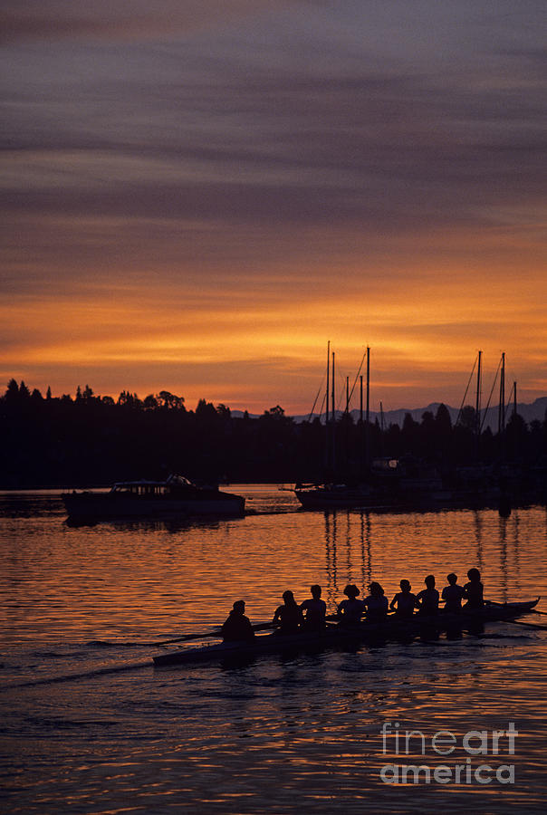 Sunrise on the Montlake Cut with eight women crew rowing  Photograph by Jim Corwin