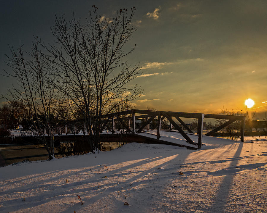 Sunrise over a snow covered bridge Photograph by Chris Bordeleau